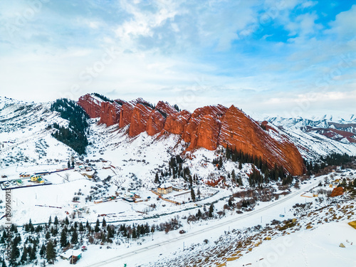Jeti-Oguz gorge in winter, Seven Bulls Red Cliffs, Kyrgyzstan, winter snowy landscape, aerial photo