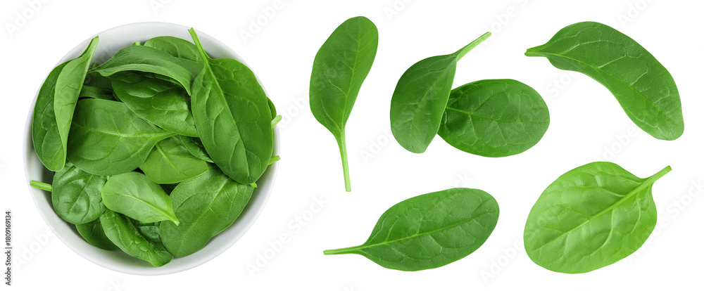 Fototapeta premium Baby spinach leaves in ceramic bowl isolated on white background. Top view. Flat lay