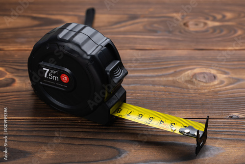 Wallpaper Mural Black tape measure on wooden background Torontodigital.ca