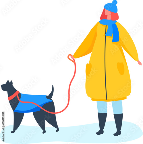 Woman walking pet dog in winter clothes