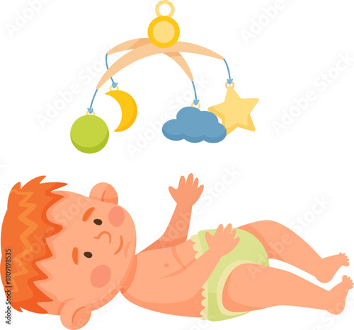 Baby playing under a colorful nursery mobile