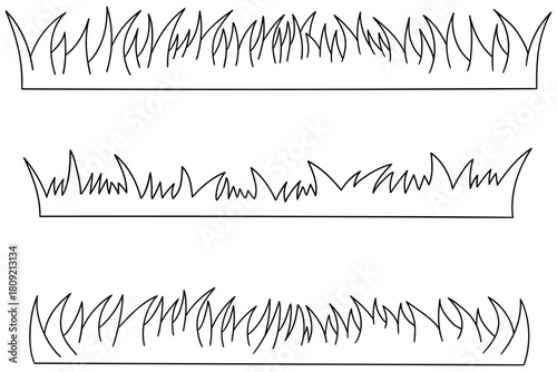 Hand-drawn doodle set of grass on a white background.