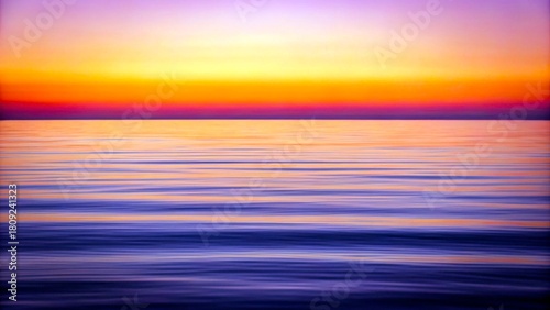 Beautiful sunset over calm ocean waters showcasing vibrant colors and serene atmosphere at twilight
