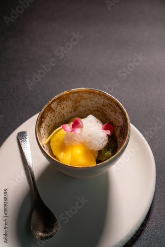 Coffee chocolate dessert with foam sauce is served on the table.
