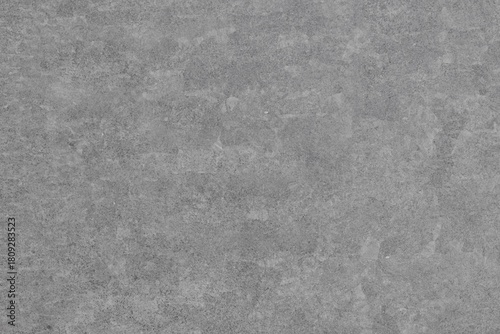 Fotografija A uniform gray background featuring a subtly rough, mottled texture with slight