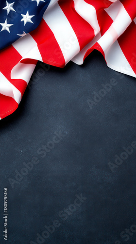 A close-up view of the American flag draped elegantly, showcasing its vibrant colors against a dark background.