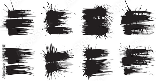 Set of eight black ink splatter brush strokes on white background