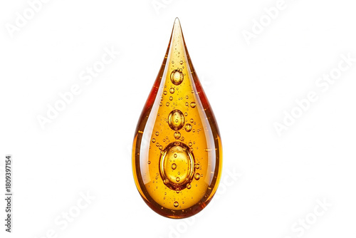 A glistening single golden drop of viscous liquid, filled with small air bubbles, symbolizing pure concentrated essence, natural richness, and valuable organic quality