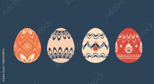 Four beautifully decorated Easter eggs with intricate folk art patterns in orange red and blue on a dark background.
