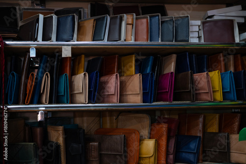 Colorful Vibrant leather handmade Moroccan bags, goods for sale in traditional local souk, story heritage and authentic oriental craftsmanship, artisanal culture Morocco