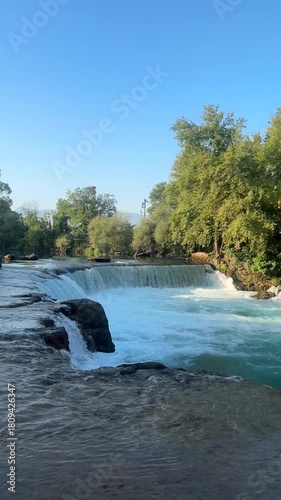 A beautiful view of the Manavgat Waterfall in the national park on a sunny summer day. Side, Antalya