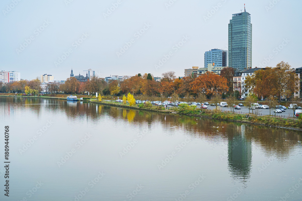 Naklejka premium Autumn and river water in Offenbach am Main harbor, Hesse.