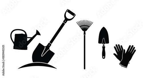 Gardening tools collection a watering can shovel rake trowel and gloves