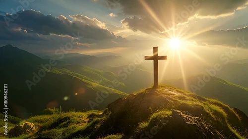 Wooden cross on hill. Sun setting over mountain range. Easter and Christian faith concept. Beautiful landscape.