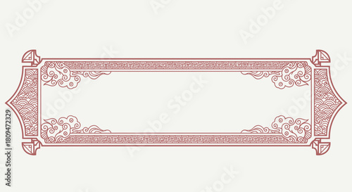 A decorative, rectangular banner frame with intricate traditional patterns in a muted red color.