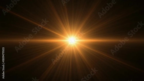 Bright golden sunburst effect with radiating light beams against a dark background, creating a warm and intense illumination.
