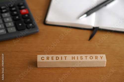 credit history. financial concepts. wooden letters with calculator, notebook, and pen