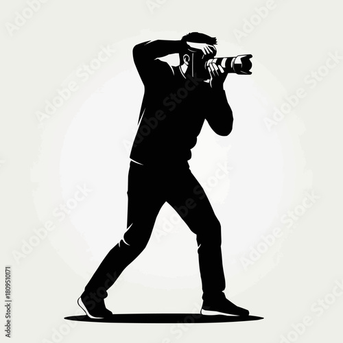 Silhouette of a male photographer capturing a moment with his camera.