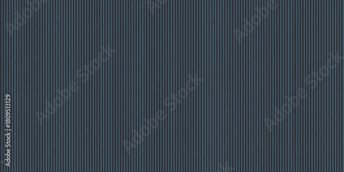 A full frame shot of a dark gray corrugated metal surface with vertical lines and subtle shadows cast on it