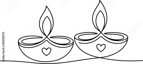 Two diya lamps with heart symbols and flames oil lamp