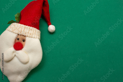 Santa Claus face on a green background - Christmas time