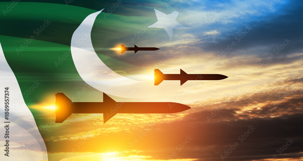 Fototapeta premium Fired missiles fly to the target. Missiles at the sky at sunset with Pakistan flag. Missile defense, a system of salvo fire.
