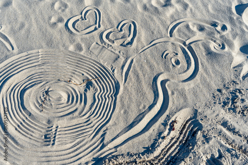 Fototapeta Naklejka Na Ścianę i Meble -  Baltic Sea coastal area with small structures wet sand and clear water forming a simple natural seaside scene