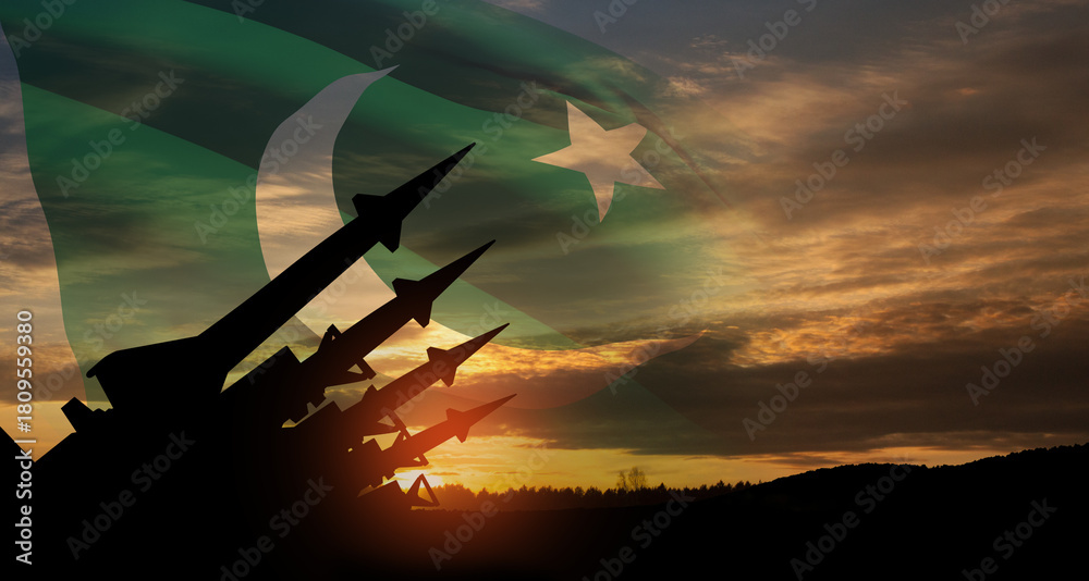 Obraz premium The missiles are aimed at the sky at sunset with Pakistan flag. Nuclear bomb, chemical weapons, missile defense, a system of salvo fire.