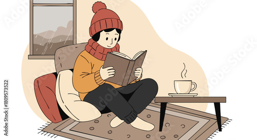 A cozy person in a winter hat and scarf is reading a book indoors with a steaming cup of tea nearby.
