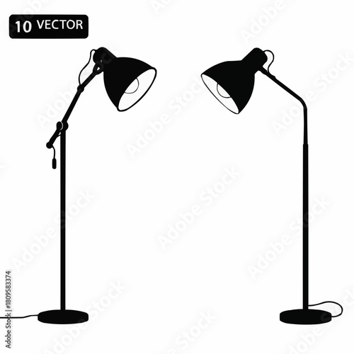 Two modern black floor lamps with adjustable heads, illuminating a space.