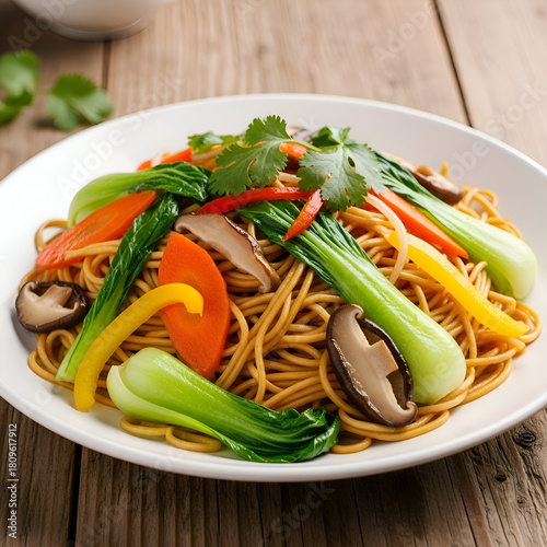 Delicious chow mein with bok choy, carrots, and mushrooms on a white plate