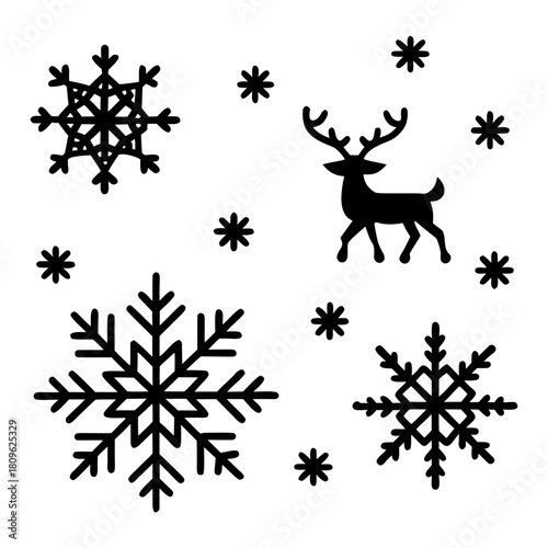 A festive arrangement of snowflakes and a reindeer silhouette isolated on, creating a wintery and holidaythemed design