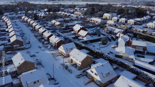 Drone. UK houses covered in snow. Icy winter, Christmas season.