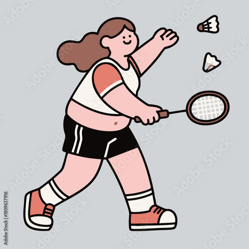 A woman is actively playing badminton, holding a racket and hitting shuttlecocks in motion.