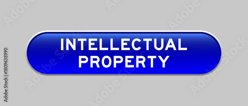 Blue color capsule shape button with word intellectual property on gray background