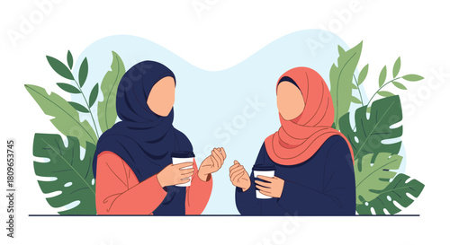 Two Muslim women friends in hijabs enjoy a friendly conversation over coffee while sitting together in a lovely green space.