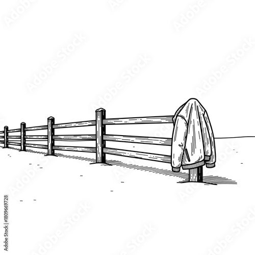 Jacket hanging on wooden fence in winter landscape  