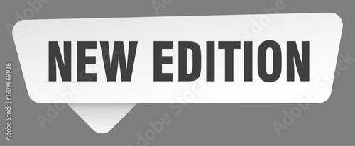 new edition sign. new edition white sticker isolated on gray background