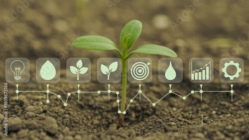 Young plant sprout growing from rich soil overlaid with digital icons representing agricultural inputs and progress