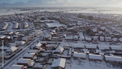 Drone. UK houses covered in snow. Icy winter, Christmas season.
