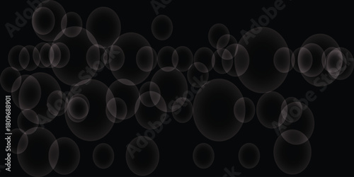 Transparent white bubbles on a black background abstract.