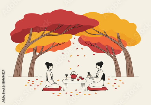 Two women enjoy a serene tea ceremony beneath vibrant autumn trees. A simple table and tea set create a peaceful, seasonal scene. Perfect for lifestyle and wellness visuals.