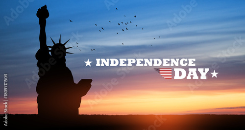 Closeup of Statue of Liberty with flying birds on background of sunset sky with text Independence Day. Greeting card for Independence Day. USA celebration.