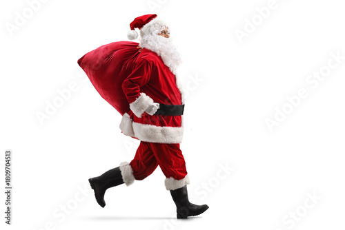 Santa claus running with a sack on his back