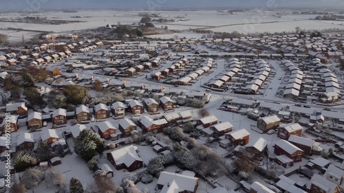 Drone. UK houses covered in snow. Icy winter, Christmas season.