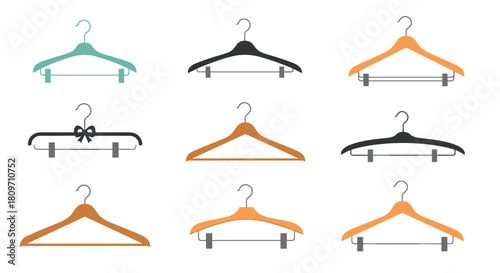 A simple and stylish set of nine clothes hangers in various designs and materials for wardrobe and fashion concepts.