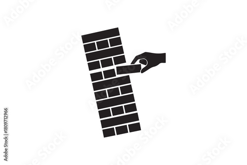 Hand pulling block from unstable tower game silhouette Business Risk And Strategy Concept Graphic