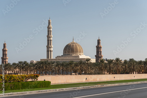 Sultan Qaboos Grand Mosque surrounded by palm trees