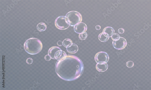 Transparent soap bubbles floating on a black background with clear liquid water spheres and light reflections
