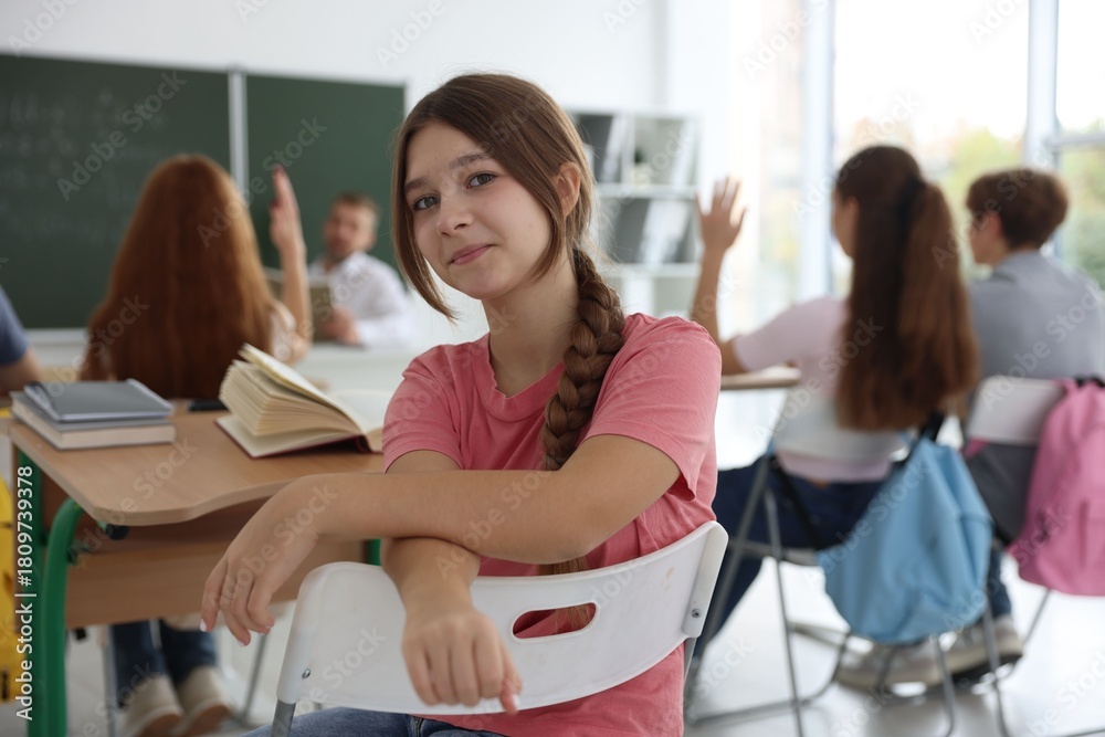 Fototapeta premium Teacher and students during lesson in classroom, selective focus